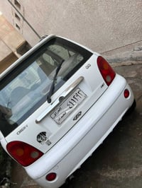 شيري QQ موديل ١٢  بيضاء  كير ومحرك وتبريد بحالة جيده ضربة خفيفة بالباب...