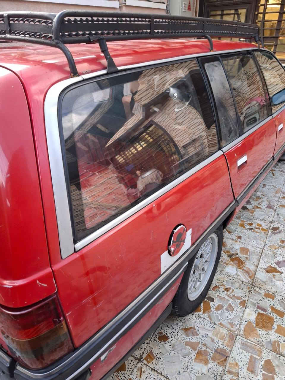 اوبل اوميكا ستيشن حمره 20  رقم انكليزي بغداد باسمي ***********
