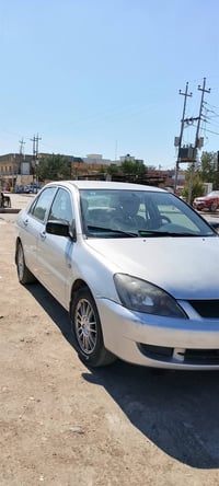 للبيع سياره لانسر موديل 2002 محدثه 2009 السياره مصبوغه حزام للجماليه ا...