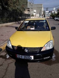 لانسر ٢٠١٠ • رقم بغداد • مكفولة كير ومحرك