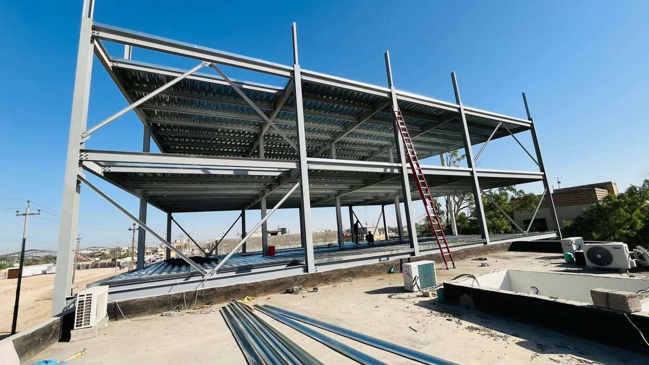 الهياكل الحديدية (Steel Structures): أساس البناء الحديث #جملونات
تُعد الهياكل الحديدية (Steel Structures) واحدة من أهم أنظمة البناء المستخدمة على نطاق واسع في المشاريع الهندسية والمعمارية الحديثة. فهي تتميز بالصلابة والمرونة وسرعة التنفيذ، مما يجعلها الخيار الأفضل للعديد من التطبيقات.

استخدامات الهياكل الحديدية (Applications of Steel Structures):

 1. المباني العالية (High-rise Buildings):
تُستخدم الهياكل الحديدية في تشييد الأبراج والمباني الشاهقة بسبب قدرتها على تحمل الأحمال الثقيلة والرياح القوية.
 2. الجسور (Bridges):
يُستخدم الحديد في تصميم الجسور بسبب خصائصه التي توفر Strength وDurability، مما يجعله مناسبًا للتعامل مع الأحمال المتكررة وحركة المرور.
 3. المنشآت الصناعية (Industrial Structures):
تُستخدم الهياكل الحديدية في المصانع والمستودعات، حيث تحتاج هذه المباني إلى مساحات واسعة دون أعمدة داخلية (Clear Span).
 4. المنشآت الرياضية (Sports Facilities):
الهياكل الحديدية توفر مرونة في التصميم لإنشاء صالات رياضية وساحات بأشكال هندسية مميزة.

مزايا الهياكل الحديدية (Advantages of Steel Structures):

 1. القوة العالية (High Strength):
يتميز الحديد بنسبة عالية من Strength-to-Weight Ratio، مما يجعله قادرًا على تحمل الأوزان الثقيلة بأقل سماكة ممكنة.
 2. سهولة التركيب (Ease of Erection):
يمكن تجميع الأجزاء الحديدية بسرعة في الموقع، مما يسرّع عملية البناء.
 3. المرونة (Flexibility):
الهياكل الحديدية تتيح التعديل والإضافة بسهولة دون الحاجة إلى تغييرات جذرية في التصميم.
 4. مقاومة الكوارث (Resistance to Disasters):
بفضل مرونته وصلابته، يتحمل الحديد القوى الناتجة عن الزلازل والرياح الشديدة.

ملاحظات هندسية (Engineering Notes):

 • يتم حماية الهياكل الحديدية من التآكل باستخدام طبقات من Paint أو Galvanization.
 • يتم تصميم الوصلات باستخدام براغي (Bolts) أو لحام (Welding) لتوفير القوة اللازمة.

الهياكل الحديدية (Steel Structures) هي الحل المثالي لتلبية متطلبات المشاريع الهندسية الحديثة. بفضل مميزاتها واستخداماتها المتعددة، أصبحت خيارًا أساسيًا في العديد من المجالات، مما يعكس تطور التكنولوجيا الهندسية.
وتساب فايبر ***********
