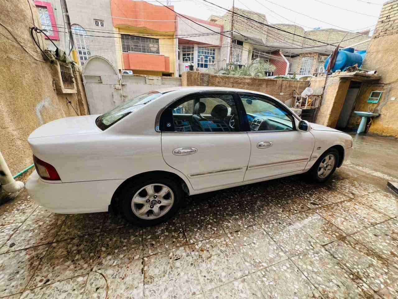 كيا اوبتيما 2005 
لون ابيض 
ويل كب بلادي 
تبريد تدفئة شغال نقص بس غاز لان متروكة 
وارد أمريكي ضربه باب بصف السايق والباب الخلفي فقط 
مكفوله شاصي  ولغد  وكص كفاله 
سيارة عدي من ٢٠٠٦ لليوم ومتروكة من 2018 لليوم 
صبغ عام بسبب الجراد 
محرك 2000
رقم بغداد  صدامي
سياره كلش حلوه يرادلها تعديل شغلات بسيطة 
عارضه 60  ورقه وبيه مجال ***********
بغداد البلديات
