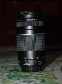 للبيع عدسة زوم Canon 75-300mm EF تركب على كل كامرات كانون بيهه عزل كلش...
