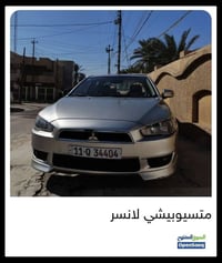 للبيع ميتسوبيشي لانسر (القرش) موديل 2016، لون فضي مميز. السيارة مخزونة...