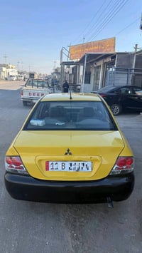 لانسر 2010 بأسمي  محرك 2000  كير عادي  ماشية ٣٥٠.٠٠٠كم تقريباً مصفرة ه...