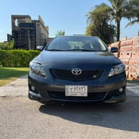 كورلا 2009 لون فيلي وراد باب الجنطة والبنيد وباب خلفي صبغ درجة اولى وع...