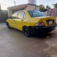 لانسر2007خليجي محرك 1600قبق ابيض كير اوتوماتيك  بيه طخه زغيره بلجاملغ ...