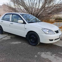 لانسر ٢٠١1 • أبيض • دبل قير