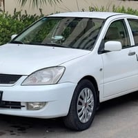 لانسر مسبوشي موديل2011  كير محرك مكفول  تبريد ثلج وتدفئه هم + شاشه بلو...