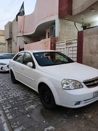 اوبترا 2012 للبيع سياره جديده صبغ بس جاملغ خلفي قليل الرقم بغداد الجدي...