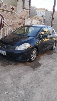 نيسان فيرسة2009 رقم انبار دولي شرط التحويل السيارة جاهزة محرك جديد قبل...