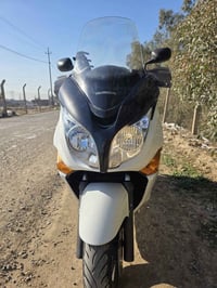 سلفر ونج جيتي  موديل 2009 محرك 400 رقم بغداد  صوت ناعمة دراجة ما متعوب...