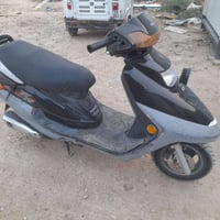 دراجة فضية • ١٠٠ ياباني • بغداد العبيدي