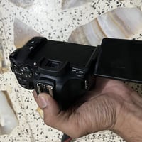 كانون ٢٥٠d • عدسة • فلاش