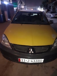 لانسر للبيع موديل 2010مكينه كير 2000عادي بيه الهلالات معمره فقط والباق...