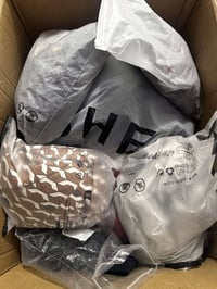 ٢٠ قطعة • ملابس • توصيل