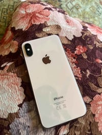 ايفون اكس ذاكرة 64 بصمة وجه واكفة ومبدل بطارية وكالة السعر 100 الف قفل...