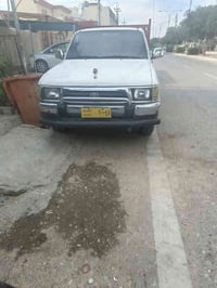 پیکاب توێتا ئەڕنەب مۆدیل 2001 ڕەقەم بغداد تەحویل ئەسلی مەکینە سپی تەقە...