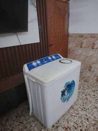 غسالة ١٤ كيلو • غسيل وتنشيف • توصيل بغداد