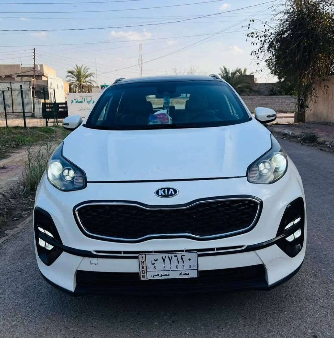 ‏Kia Sportage SXL 2000 Turbo 2021   سبورتج 2021 وارد امريكي لون ابيض رقم بغداد حرة باسمي  السيارة اني مستوردها ع ايدي حادثها تبديل جاملغ وبنيد ايرباك ستيرن فقط ماشية تقريبا 83 الف ميل السيارة فووووول مواصفات 1/1 فئة SXL    مواصفاتها  محرك 2000 تيربو دبل كزوز   / سقف بانوراما قطعتين / بصمه ابواب و تشغيل و صندوق / ستيرن حرف دي تحكم ستيرن كامل / تبريد امامي خلفي / شحن لاسلكي / كشنات جلد لونين كريمي واسود + الاماميات كهرباء تدفئة وتبريد / تدفئة استيرن / انارة داخلية لد / رادار امامي + جانبي مرآة + خلفي  / لايتات زينون عالي ناصي + بك لايت لد / سيتم سماعات 10 سماعة هارمن كاردن صوت مرعب  / سايد بريك كهربائي (بصمه) / اوتو هولد / شفتات ستيرن / شاشة كبيرة بلادية / اشاير مرايات جانبية + شفط  /ويل 19 بلادي كروم / رادار خروج عن المسار  ...  وبعد هواي بيها مواصفات    رايدها غير متواجد ع الفيس للاستفسار الاتصال ***********
