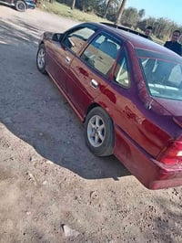 وبركاته  سياره اوبل فكترا موديل 1992حجم 18گير عادي رقم بغداد  دولي  دا...