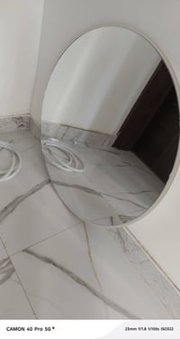 مراية ظهر خشب • قطر ٨٠ سم • بغداد المنصور