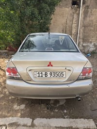 لانسر موديل 2007 محرك 2000 بيها بابتين وجاملغات اثنين صبغ أثر الجراد س...