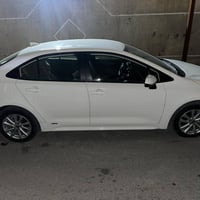 LE ياباني  بانزين + كهرباء هايبرد وارد امريكي موديل   2024 لون ابيض  م...