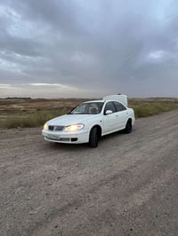 نيسان سني 2003ياباني سيارة مصبوغة عام وبيها ضربه  بل بجم ولسياره كلش ح...