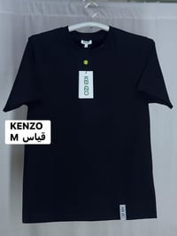 قميص  (كنزو)ً سوبر كريم   قياس  ً M  النظافه 💯/💯    يوجد توصيل 🚚 (بغدا...
