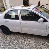 لانسر موديل 2001بسمي رقم واسط مصبوغه جماليه مكفوله من اي ضربه كير ومكي...