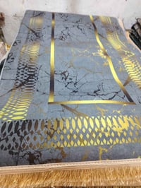 بضاعة جديدة • سجادة هندية • مذهب