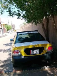 لانسر مشبوشي موديل 10 محرك 1600.... رقم بغداد نكليزي بسمي.....  .. سيا...