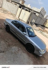 كيا اوبتيما • ٢٠٠٠ • رقم نجف