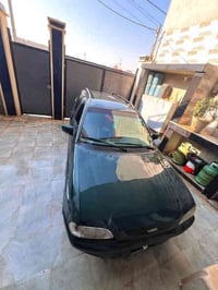 سياره فورد استيشن للبيع رقم أخضر الشرعي موجود سنوية بيضاء بيها كابون و...