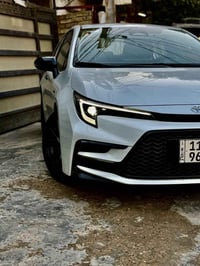 كورلا موديل 2025 لون صدفي المرغوب ماشية ١٩ الف شكل الاس S  مرقم بغداد ...