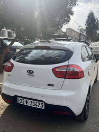 كيا ريو 2014 كلين السعر 95$ .... للتواصل 07734339451