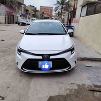 كورلا هايبرد 2024  محرك 1.8 هايبرد  رقم بغداد سنوية بإسمي  لايتات زينو...