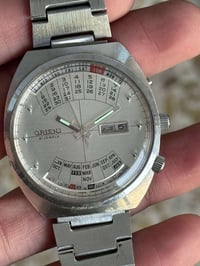 ساعة اورينت دولي اتوماتيك انتاج قديم  نافذة عرض الشهري و اليومي  القطر...