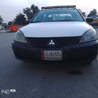 لانسر 2010 رقم صلاح الدين سنوية جديده كير عادي بدون ضرر فقط صبغ حزام س...