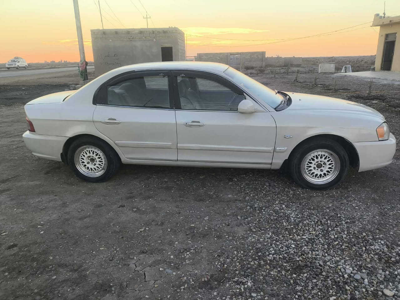 كيا اوبتيما ٢٠٠٥ رقم واسط اللون ابيض لؤلؤي محرك ٢٠٠٠  كير عادي مصبوغه حزام السعر ٤٥ وبيه مجال      ***********
