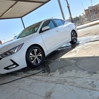 بيع او مرواس نيسان سنترا 2023  ابيض صدفي ضرر بنبد بدون دواخل شرط مواصف...