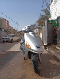 دراجة فراشه • حاوية • نجف