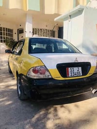 لانسر تكسي 2010 جاهزه من كلشي. باسمي تحويل ثاني يوم رقم بغداد انكليزي ...