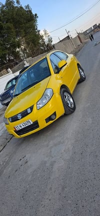 ساسوكي مديل 2011 /مكفوله. من صبغ. وضربه بسمي رقم بغداد نكليزي مصفره هي...