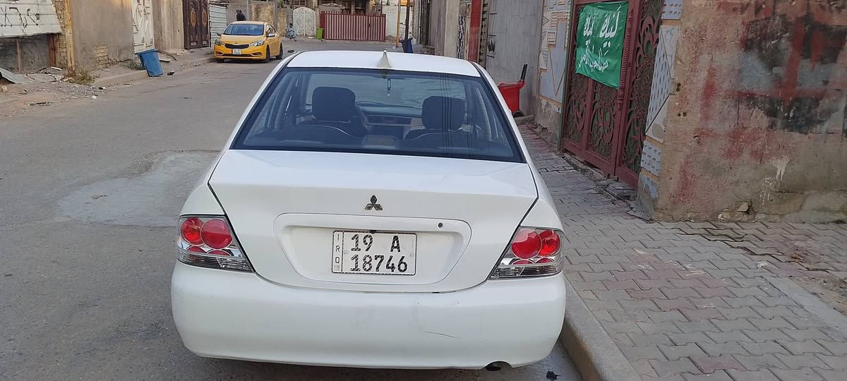 لانسر موديل 2010مشروع وطني باسمي مصبوغه حزام رقم كربلاء تبريد ثلج مكينه 1600قبق اسود كير اتو ب68بلعافيه على الياخذها مابيها اي نقص متواجد واتساب ***********بغداد
