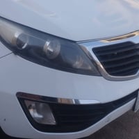 كيا سبورتاج 2011 رقم بصره الماني ماشيه 150 الف  السياره بيها ضربه جامل...