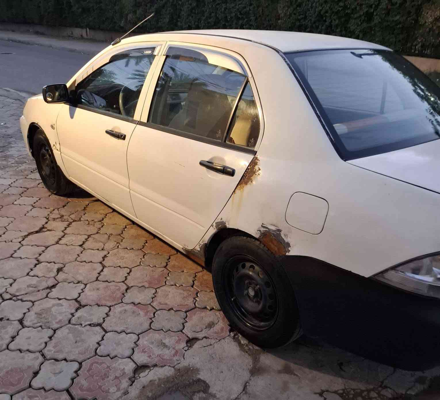 سلام عليكم لانسر للبيع 2006 بيه كم قطعة صبغ ابيع حزام مكينة جديدة شادله 2000 كير حدادية تبريد كفالة تايرات جدد سيارة بس يرادله صبغ مكصوص للاخياس السعر 69بيه مجال قليل مكاني شهربان *********** مكلف بنشرهة
