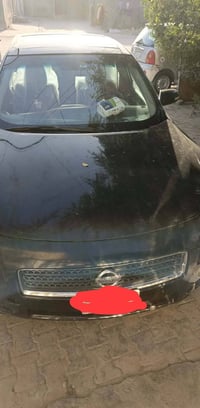 سيارة نيسان موديل 2013 فول موصفات مع كفاله عامه   07813296697