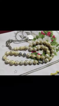 سبحة عاج الفقمة • 33حبة • تطعيم فضة